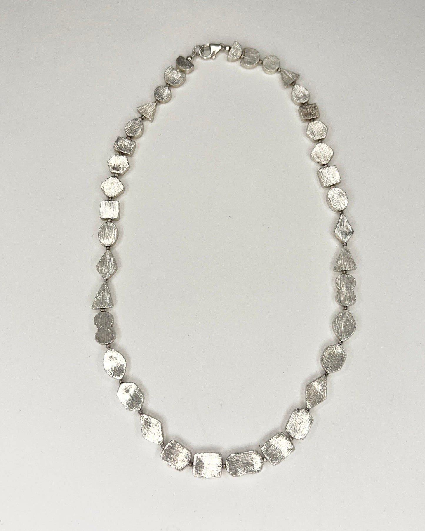brushed silver shapes necklace