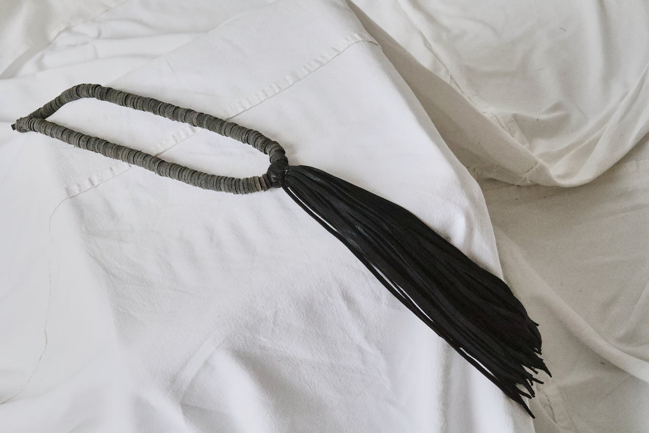 black leather sequins with deerskin tassel